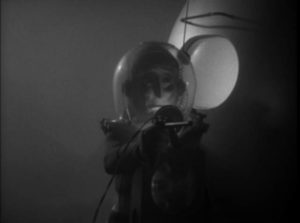 The alien emerges with his mind-controlling raygun in Edgar G. Ulmer's The Man from Planet X (1951)