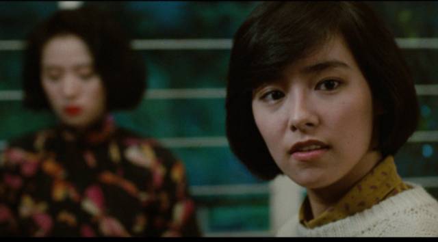 Yuen-Ting (Alex Man)'s girlfriend reporter Ah Chor (Emily Chu) becomes fascinated with Fleur (Anita Mui)'s story in Stanley Kwan's Rouge (1987)