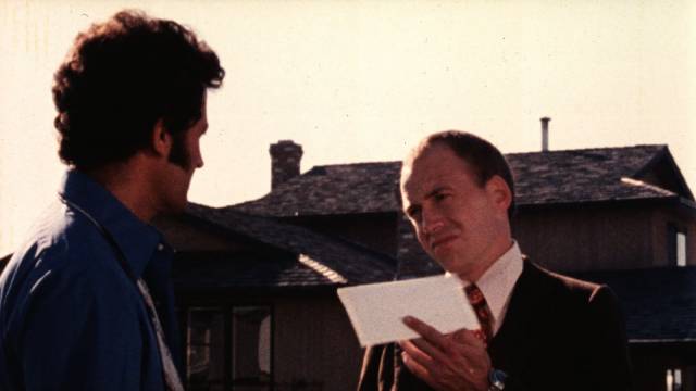John Collins (David Petersen) tells George Pettigrew (Alan Rose) that his time has run out in Zale Dalen's Skip Tracer (1977)