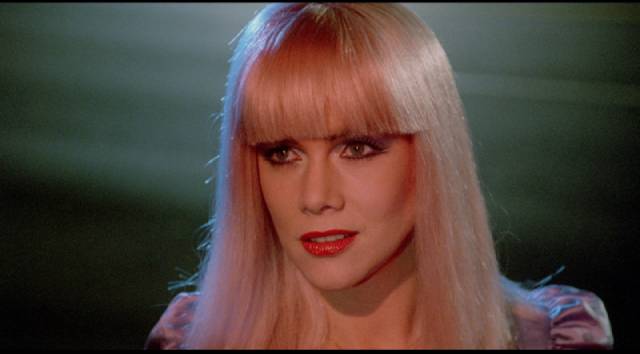 China Blue (Kathleen Turner) reflects whatever image a john is looking for in Ken Russell's Crimes of Passion (1984)