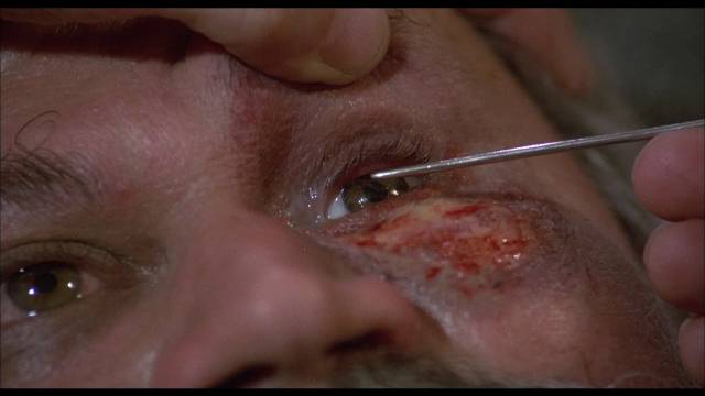 ... as he demonstrates the efficacy of his new cocaine-based anaesthetic in Gérard Kikoïne’s Edge of Sanity (1989)