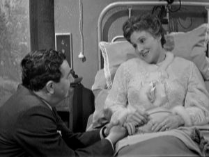 Maigret (Rupert Davies) takes a moment to visit Mme. Maigret (Helen Shingler) in hospital in the BBC's Maigret (1960-63)