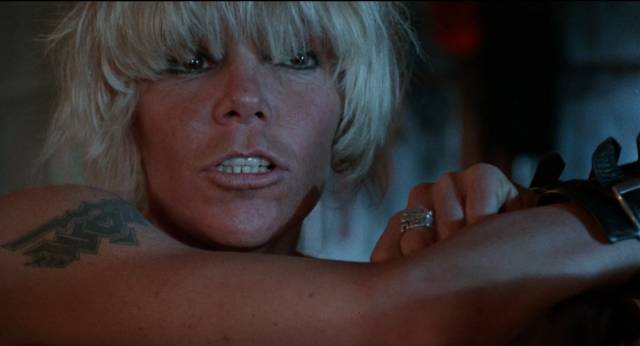 Wendy O. Wi8lliams as alpha inmate Charlie in Tom DeSimone's Reform School Girls (1986)