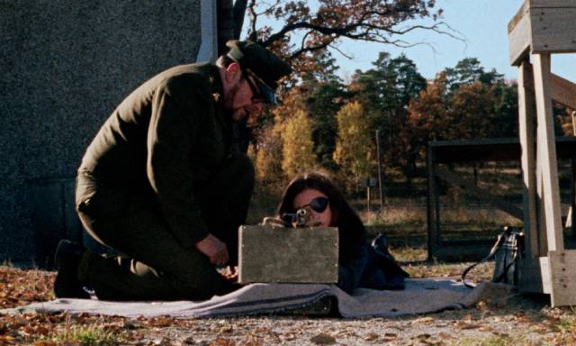 Madeleine (Christina Lindberg) gets weapons training in Bo Arne Vibenius' Thriller: A Cruel Picture (1973)