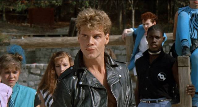 ... but her boyfriend Frankie (Craig Sheffer) doesn't approve in James Fargo's Voyage of the Rock Aliens (1984)