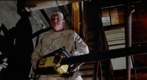 Michael Berryman prowls around town with his favourite tool in James Fargo's Voyage of the Rock Aliens (1984)