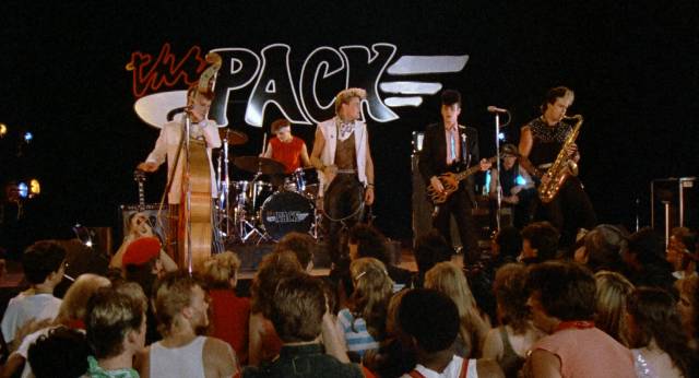 The aliens and Frankie (Craig Sheffer)'s rock-a-billy band face off at the town dance in James Fargo's Voyage of the Rock Aliens (1984)