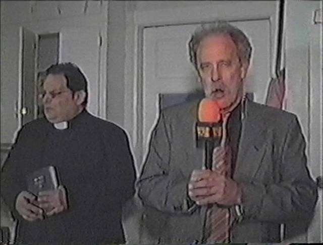 Reporter Frank Stewart (Paul Fahrenkopf) prepares to investigate the murder house in Chris LaMartina’s WNUF Halloween Special (2013)