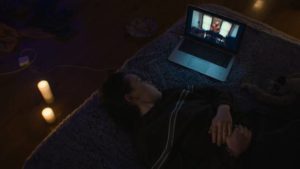 Casey (Anna Cobb) watches videos from other people who have taken the "challenge" in Jane Schoenbrun’s We’re All Going to the World’s Fair (2021)