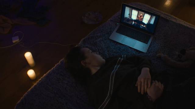 Casey (Anna Cobb) watches videos from other people who have taken the "challenge" in Jane Schoenbrun’s We’re All Going to the World’s Fair (2021)