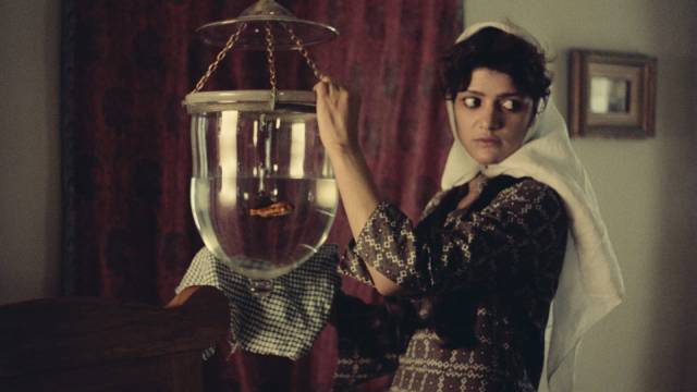 Servant Kanizak (Shohreh Aghdashlou) closely observes the conflicts with the family in Mohammad Reza Aslani’s Chess of the Wind (1979)