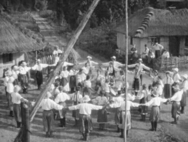 Villagers celebrate the harvest just before the Russian army arrives in Edgar G. Ulmer's Cossacks in Exile (1938)