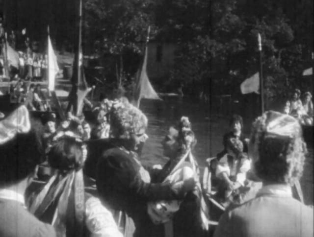 Andrey (Alexis Tcherkasshy) and Oksana (Helen Orlenko) lead the Cossacks back to Ukraine in Edgar G. Ulmer's Cossacks in Exile (1938)