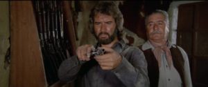 An escaped prisoner (Rogelio Guerra) trades his horse for a gun in Rene Cardona Jr's Guns & Guts (1974)