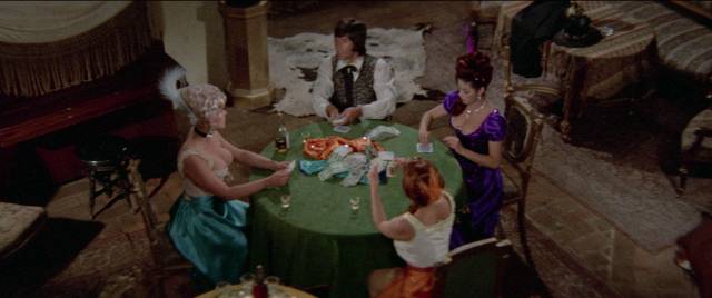 A hired gunman (Jorge Rivera) prefers to play strip poker with prostitutes in Rene Cardona's Guns and Guts (1974)