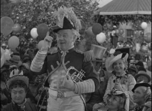 Captain Andy (Charles Winninger) leads the parade to drum up an audience in James Whale's Show Boat (1936)