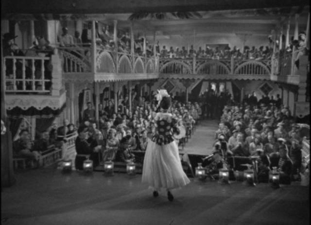 The segregated audience, White below, Black in the balcony, watch Magnolia's Blackface performance in James Whale's Show Boat (1936)