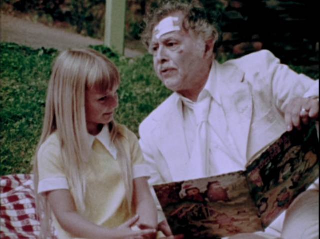 For a brief moment, a young girl offers human contact in George A. Romero's The Amusement Park (1975)