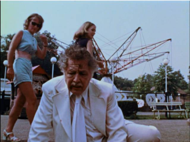 ... and passersby barely give the elderly man a glance in George A. Romero's The Amusement Park (1975)