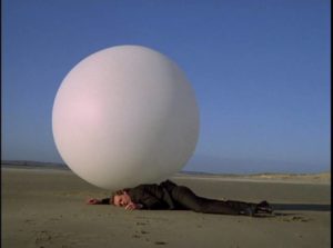 The Village watchdog Rover subdues No. 6 (Patrick McGoohan) in The Prisoner (1967)