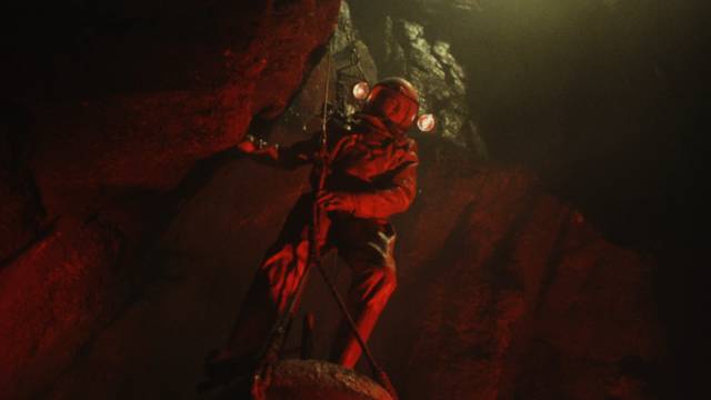 Dr. Ted Rampion (Keiron Moore) descends into a volcano with an atom bomb in Andrew Marton's Crack in the World (1965)