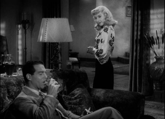 Phyllis Dietrichson (Barbara Stanwyck) sizes up the unsuspecting Walter Neff (Fred MacMurray) in Billy Wilder’s Double Indemnity (1944)