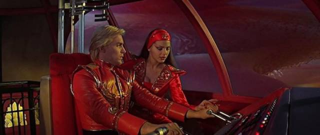 Flash (Sam J. Jones) and Proncess Aura (Ornella Muti) try to escape Ming's city in Mike Hodges' Flash Gordon (1980)