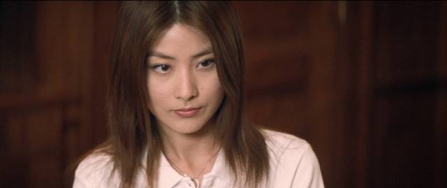 Dr. Lee Sum Yee (Kelly Chen) becomes personally involved with Yan (Tony Leung Chiu-Wai) in Andrew Lau Wai-keung and Alan Mak’s Infernal Affairs (2002)