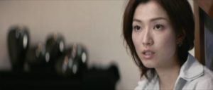 Lau's wife Mary (Sammi Cheng Sau-man) discovers that she doesn't really know him in Andrew Lau Wai-keung and Alan Mak’s Infernal Affairs (2002)