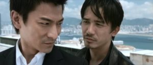 Undercover cop Yan (Tony Leung Chiu-Wai) and triad mole Lau (Andy Lau) finally meet in Andrew Lau Wai-keung and Alan Mak’s Infernal Affairs (2002)
