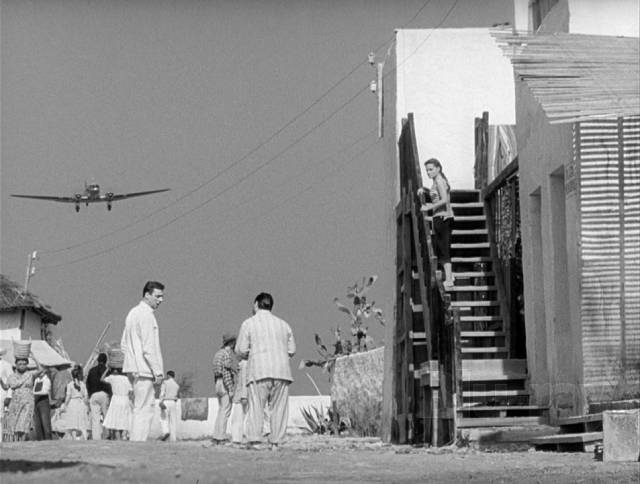 An incoming plane offers a tantalizing glimpse of potential escape in Henri-Georges Clouzot’s The Wages of Fear (1953)