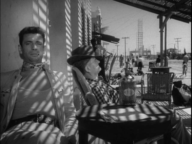 Mario (Yves Montand) marks time in the middle of nowhere in Henri-Georges Clouzot's The Wages of Fear (1953)