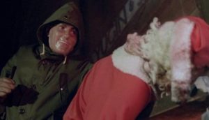 A masked madman doesn't like Santa in Alan Birkinshaw's Don't Open Till Christmas (1984)