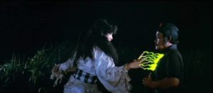 The rejuvenated Leák Queen (Debbie Cinthya Dewi) zaps Mahendra's uncle with her magical power in H. Tjut Djalil’s Mystics in Bali (1981)
