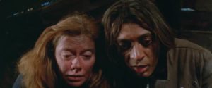 Mazella (Don Calfa) and Gladys (Kate Reid) are amazed they've actually found the gold in Gerald Potterton's The Rainbow Boys (1975)