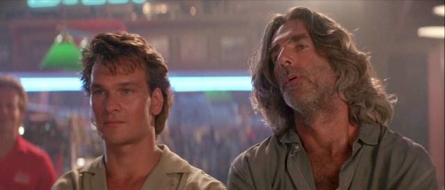 Dalton gets backup from his mentor Wade Garrett (Sam Elliott) in Rowdy Herrington's Road House (1989)