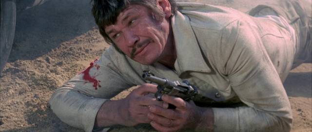 Hit man Jeff Heston (Charles Bronson) survives an assassination attempt in Sergio Sollima's Violent City (1970)