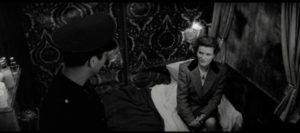 Katharina Hartmann (Barbara Sukowa) seeks comfort from sleeping car conductor Leopold Kessler (Jean-Marc Barr) in Lars von Trier's Europa (1991)
