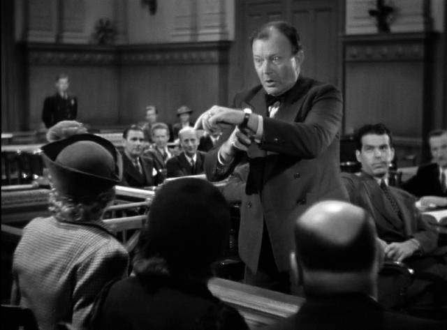 Defense attorney Francis X. O'Leary (Willard Robertson) gives a histrionic summation in Mitchell Leisen's Remember the Night (1940)