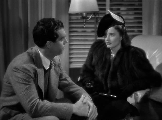 Lee (Barbara Stanwyck) is dumped on prosecutor John Sargent (Fred MacMurray)'s doorstep for Christmas in Mitchell Leisen's Remember the Night (1940)
