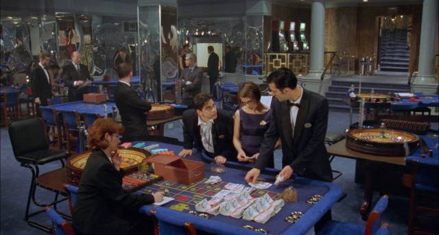 The money means nothing; Jack (Clive Owen)'s addiction is to other people's desperation in Mike Hodges' Croupier (1997)
