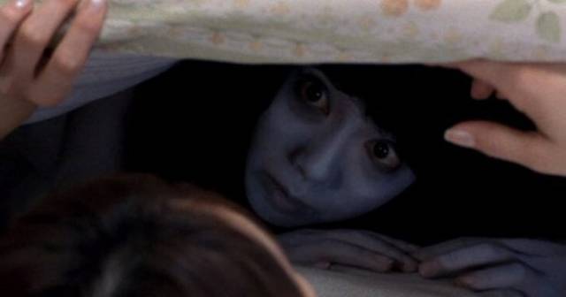 Even bed isn't secure from angry ghost Kayako in Takashi Shimizu's Ju-On: The Grudge (2002)