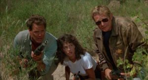 Lawyer Ken Griffiths (Wings Hauser), deputy Julia (Kimberly Ross) and ex-cop Reilly (Bo Hopkins) pursue the Albino (Brion James) into the desert in Nico Mastorakis' Nightmare at Noon (1988)