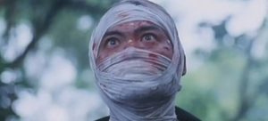 A madman (Mak Siu-Wah) kills visitors to his island in Bowie Lau’s The Deadly Camp (1999)