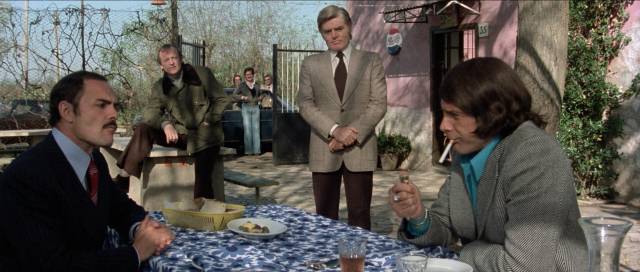 Luigi Maietto (Tomas Milian makes a deal with bigshot gangster Frank Di Maggio (John Saxon) in Umberto Lenzi's The Cynic, the Rat and the Fist (1977)