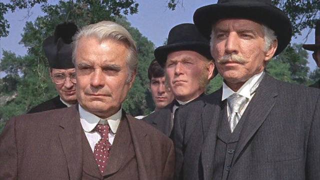Members of the council wait nervously for Marshal Patch (Richard Widmark)'s response in Death of a Gunfighter (1969)
