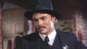 Sheriff Lou Trinidad (John Saxon) is ordered to arrest his mentor Marshal Patch (Richard Widmark) in Death of a Gunfighter (1969)