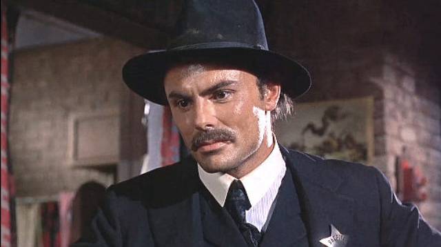 Sheriff Lou Trinidad (John Saxon) is ordered to arrest his mentor Marshal Patch (Richard Widmark) in Death of a Gunfighter (1969)