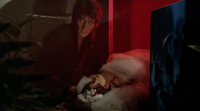 John Harrington (Stephen Forsyth) disposes of Alice Norton (Femi Benussi) in his furnace in Mario Bava's Hatchet for the Honeymoon (1970)