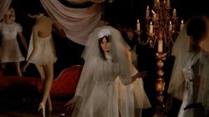 Model Alice Norton (Femi Benussi) makes the mistake of accepting the gift of a bridal gown from John Harrington (Stephen Forsyth) in Mario Bava's Hatchet for the Honeymoon (1970)